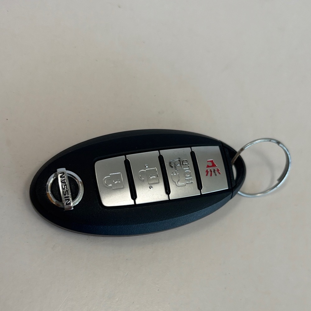 Original Nissan Key Fob with Black and Silver keyless entry Original Nissan key